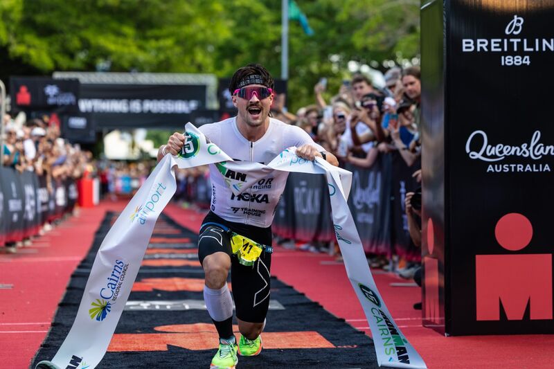 Nick Thompson breaking the finish tape to win Ironman Cairns 2026